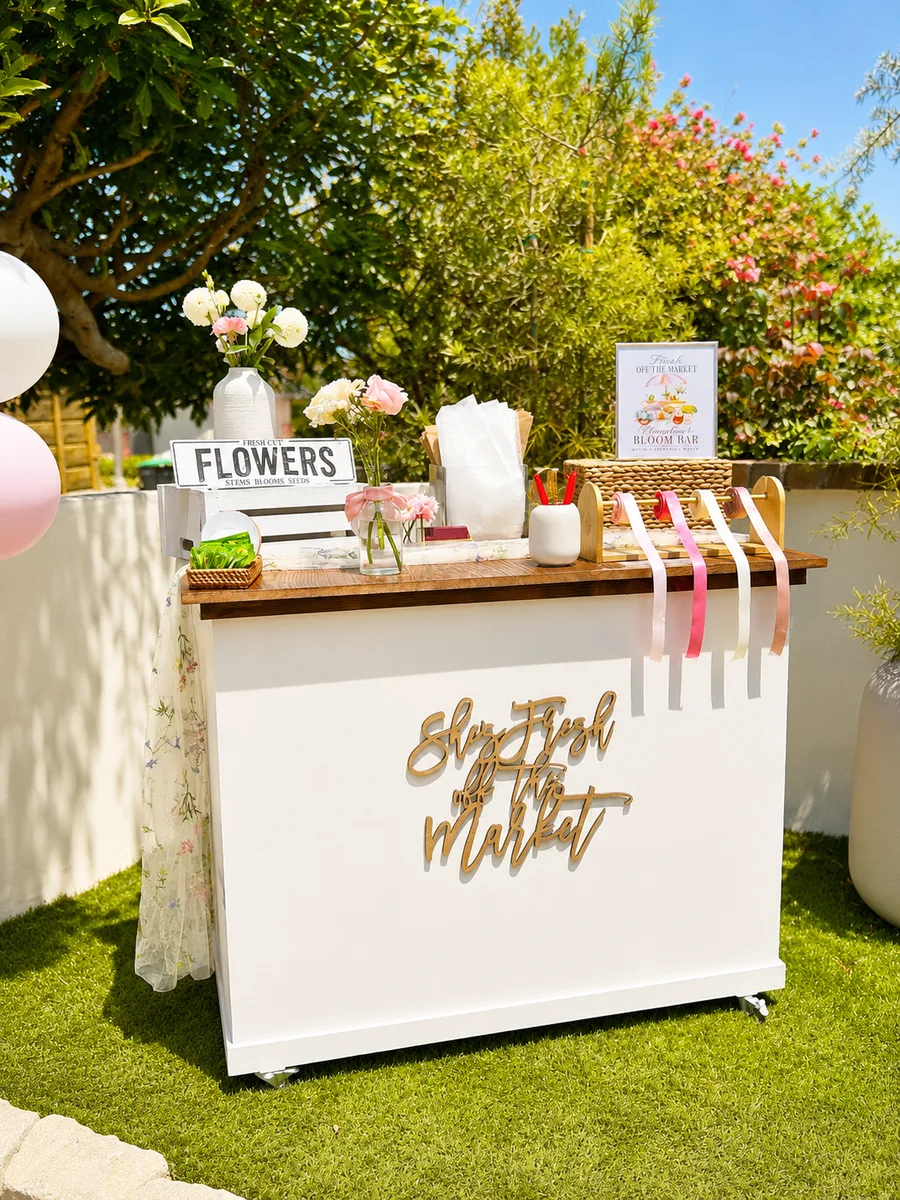 Bridal shower bloom bar with She's Fresh off the Market gold sign in Orange County