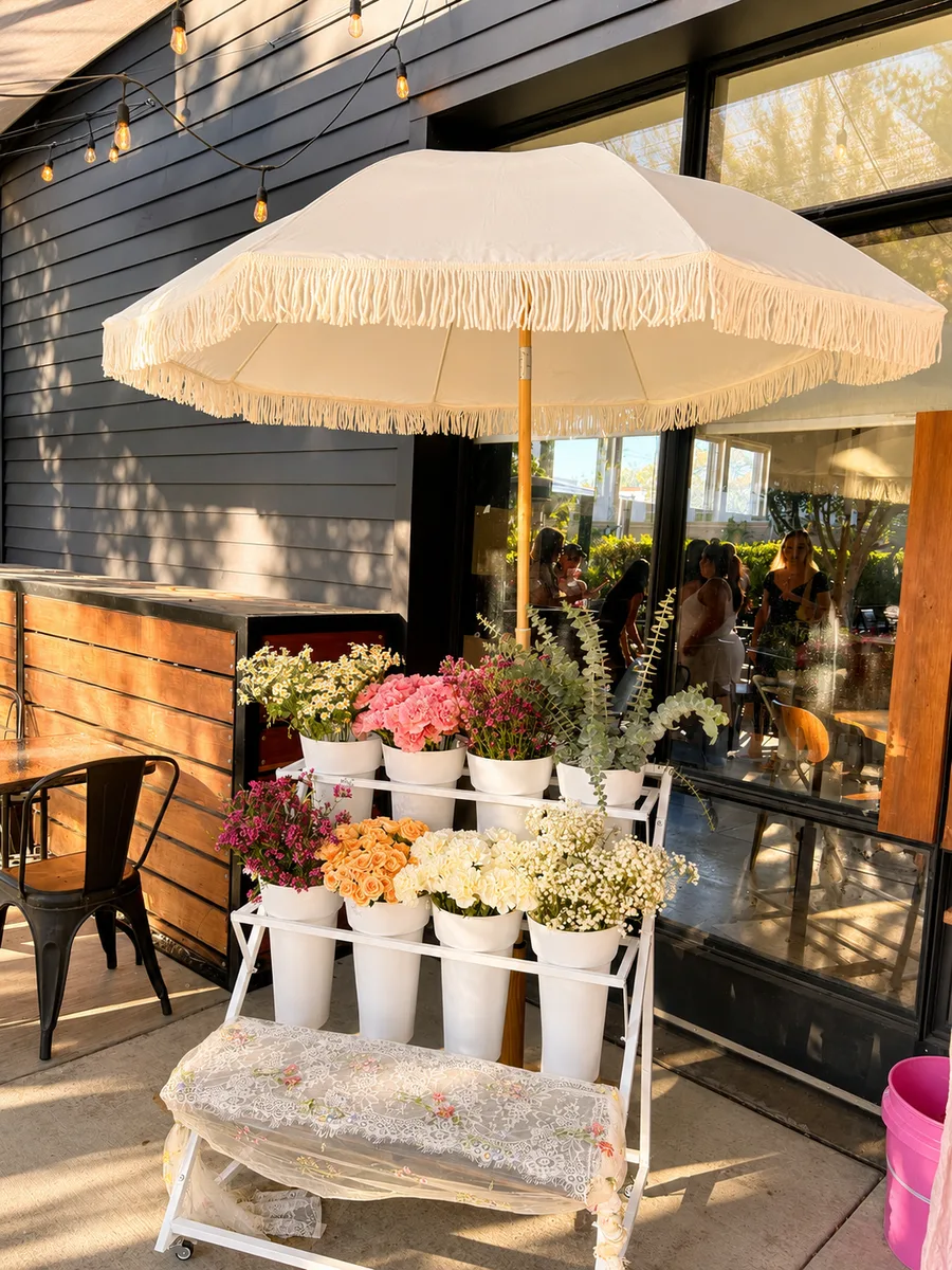 Bloom bar outdoor patio setup with fringe umbrella in Orange County